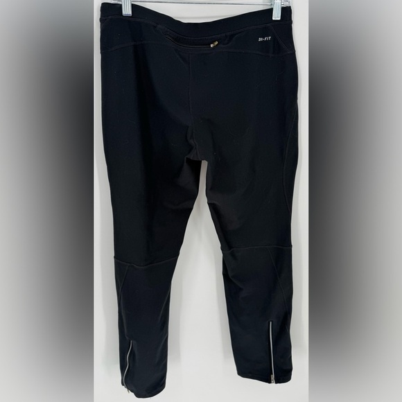 Nike Women's Dri-FIT Unlimited Zippered Cuff Versatile Pants - Picture 8 of 16